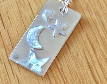 Unique large handmade sterling silver tab pendant with moon and stars.