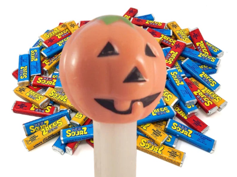 Pumpkin PEZ Candy Dispenser Glow in the Dark White Orange Jack O Lantern Halloween Collectible Toy Made in Hungary