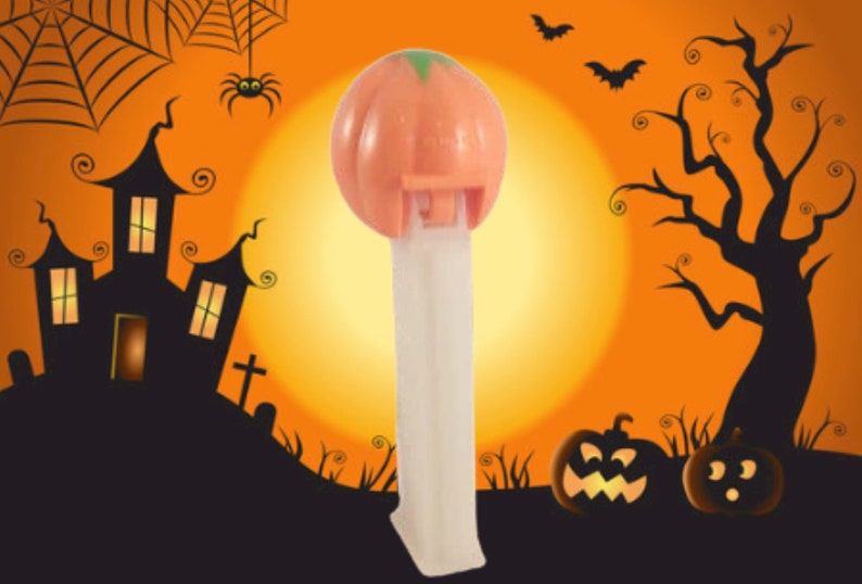 Pumpkin PEZ Candy Dispenser Glow in the Dark White Orange Jack O Lantern Halloween Collectible Toy Made in Hungary