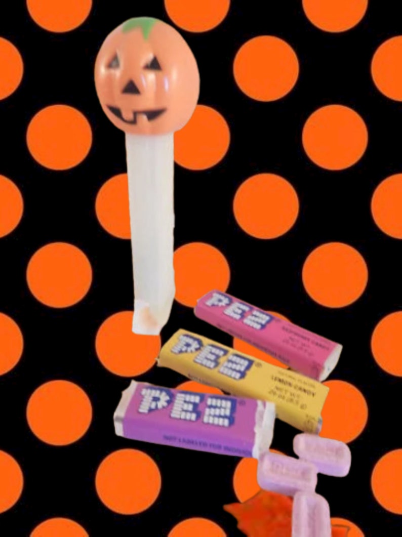 Pumpkin PEZ Candy Dispenser Glow in the Dark White Orange Jack O Lantern Halloween Collectible Toy Made in Hungary