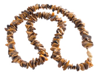 May include: A long necklace made of brown and gold tiger's eye stones. The stones are faceted and have a natural, irregular shape. The necklace is strung on a thin gold chain.