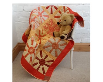 Quilt pattern: baby cot crib baby blanket or wall-hanging or throw, sun quilt, burnt orange, pieced top PDF  'Here comes the sun!'