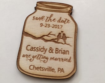 May include: Wooden save the date magnet shaped like a mason jar with the text "save the date 9-23-2017 Cassidy & Brian are getting married Chetsville, PA"