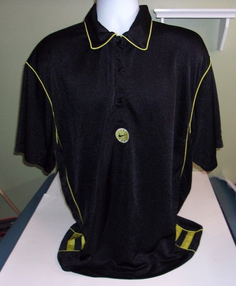 red black and yellow nike shirt