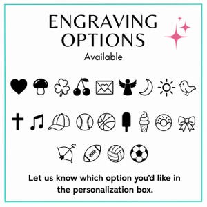 May include: A white graphic chart titled ENGRAVING OPTIONS Available, featuring twenty-three black icons including a heart, mushroom, clover, cherries, envelope, angel, moon, sun, bird, cross, music note, cap, balls, ice cream, donut, bow, and sports balls.