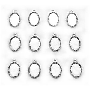 May include: Twelve silver oval-shaped pendant trays with a rope-like border. The trays are blank and ready for crafting.