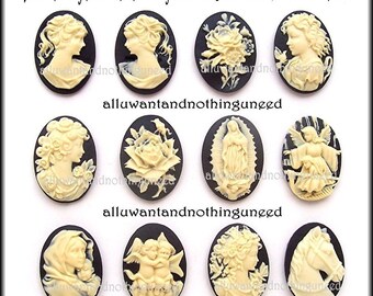 May include: Twelve assorted ivory cameo buttons on black backgrounds. Each button is 25mm x 18mm and features a different design, including a rose, an angel, and a woman's profile.