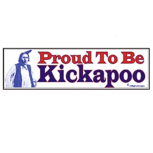 May include: A white banner with blue and red text that reads "Proud To Be Kickapoo". A black and white image of a person in traditional clothing is on the left side of the banner.
