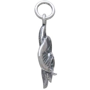 Peut inclure: Un charme en argent en forme de fleur d'orchid&eacute;e. Le charme a une boucle en haut pour l'attacher &agrave; un bracelet ou un collier.