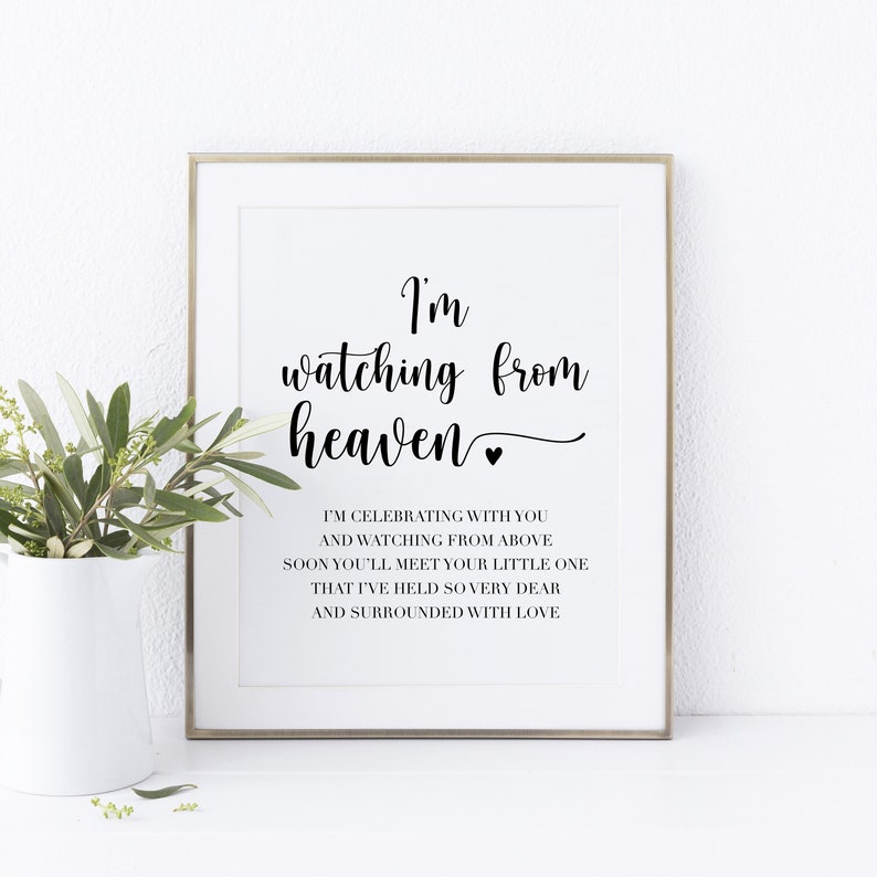May include: A black and white printable quote that reads "I'm watching from heaven" with a small heart symbol. The quote continues with "I'm celebrating with you and watching from above. Soon you'll meet your little one that I've held so very dear and surrounded with love."
