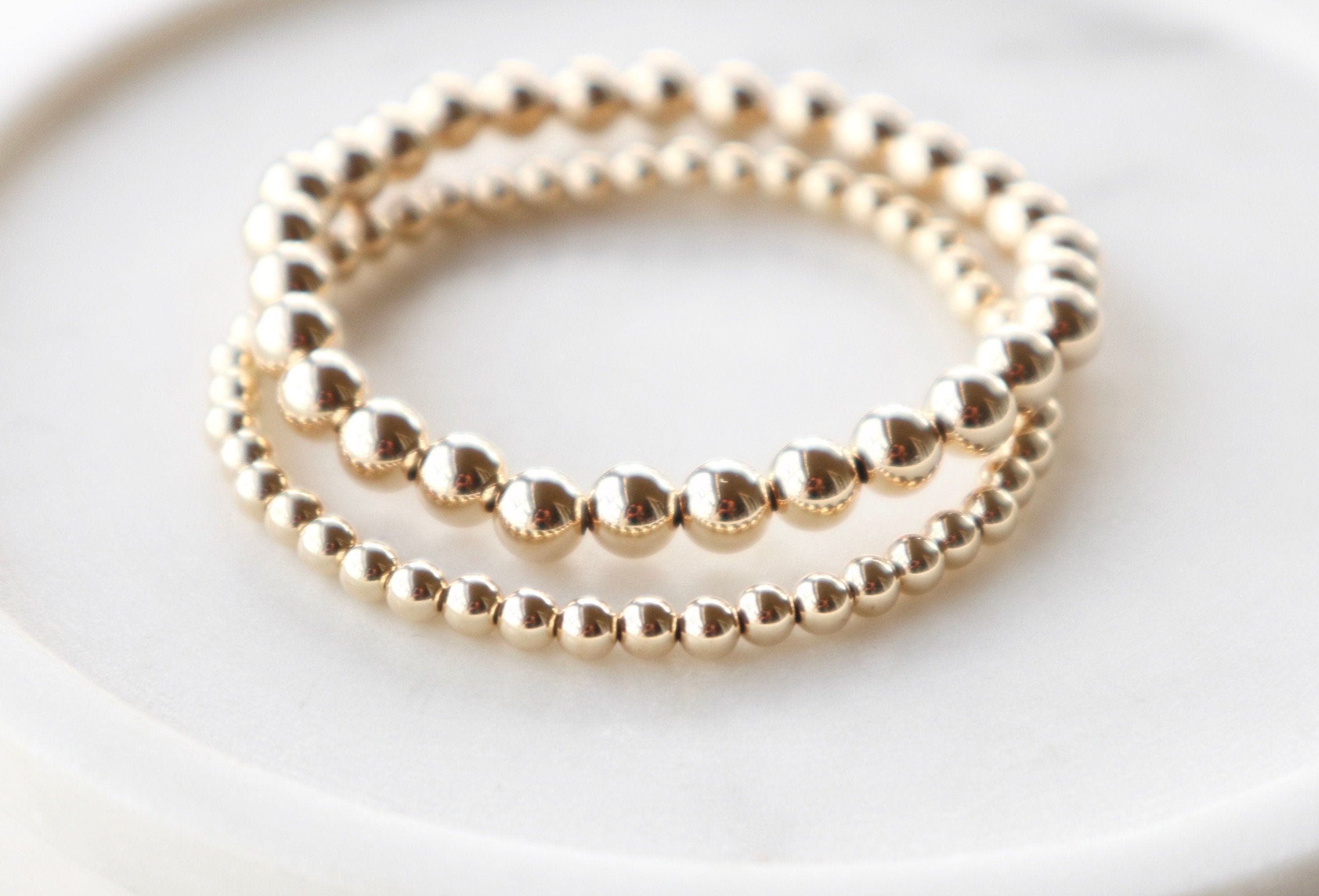 QUINSCO SARAH Bracelet - 14k yellow gold-filled round bead stretch br…