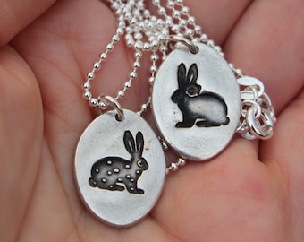 Rabbit pendant necklaces handcrafted in solid silver with a cute embossed rabbit print