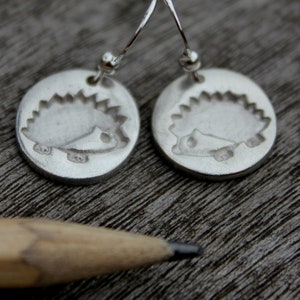 Hedgehog dangle earrings handmade in silver with an embossed hedgehog. Inspired by nature and wildlife. Perfect for a hedgehog lover. image 2