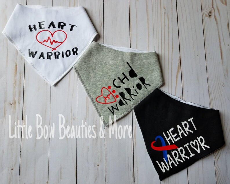 May include: Three white fabric bandanas with different designs. The first bandana has a red heart with a heartbeat line and the text "HEART WARRIOR". The second bandana has a red heart with a heartbeat line and the text "CHD WARRIOR". The third bandana has a blue ribbon with a red heart and the text "HEART WARRIOR".