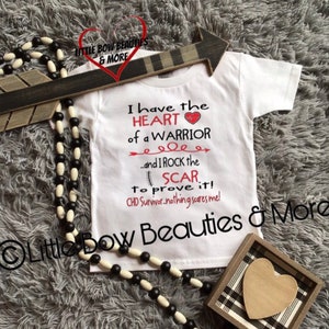 May include: White baby onesie with a red heart and the text "I have the HEART of a WARRIOR...and I ROCK the SCAR to prove it! CHD Survivor.nothing scares me!"