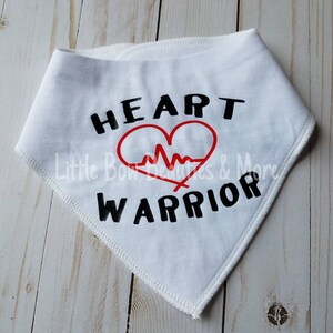May include: White bandana with black text that reads "HEART WARRIOR" and a red heart with a red EKG line inside.