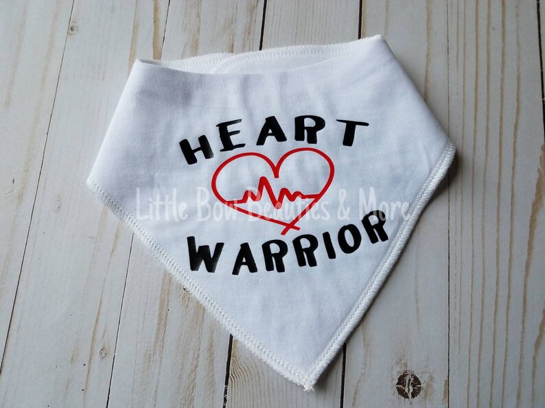 May include: White bandana with black text that reads "HEART WARRIOR" and a red heart with a red EKG line inside.