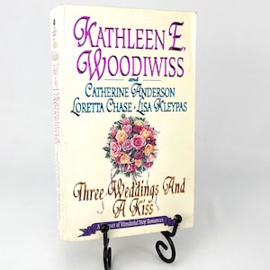 Tre matrimoni e un bacio di Kathleen E. Woodiwiss Loretta Chase Lisa Kleypas Catherine Anderson Prima ristampa Brossura 1995