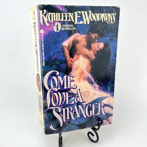 Come Love a Stranger di Kathleen E. Woodiwiss 1a stampa Avon con copertina Clinch 1986