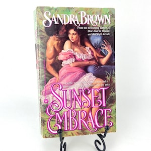 Sunset Embrace di Sandra Brown, seconda edizione Warner, 1990, copertina flessibile con copertina flessibile
