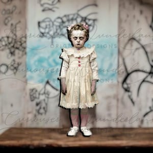 May include: A young girl with pale skin and dark hair is wearing a white dress with lace trim and pink shoes. She is standing in front of a wall with graffiti and a blue background.