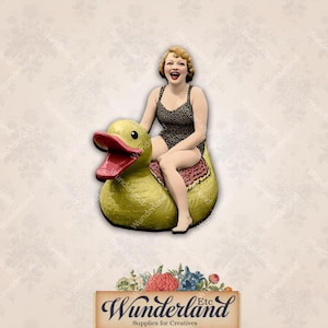 May include: A woman in a black and white swimsuit sits on a yellow rubber duck. The duck has a red beak and a pink and white patterned base.
