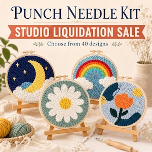 May include: A punch needle kit featuring four circular embroidery hoops on wooden stands. Designs include a yellow moon with stars, a rainbow with clouds, a white daisy on green, and an orange flower. Text reads PUNCH NEEDLE KIT STUDIO LIQUIDATION SALE.