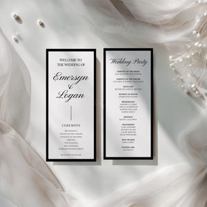 Könnte beinhalten: Zwei rechteckige Hochzeitskarten mit schwarzem Rand und schwarzer Serifenschrift sowie Schreibschrift auf weißem Hintergrund. Die linke Karte trägt die Aufschrift Welcome to the Wedding of Emersyn & Logan Ceremony.