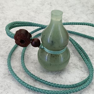 Natürliche Taillen-Jade-Kürbis-Anhänger-Halskette: Handgemachte Schnur-Amulett