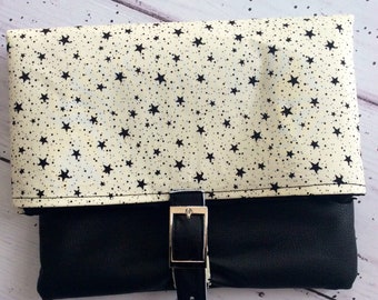 Black faux leather star print black and white  leatherette silver buckle clutch bag