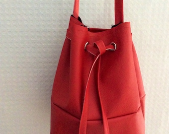 Red berry faux leather eyelet bucket shoulder bag