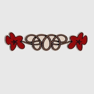May include: Red embroidered flowers with brown knotted rope design.