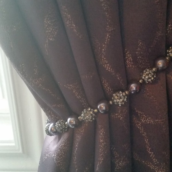 Beaded drapery tie-back with smokey mauve/purple beads, on silver wire. Dainty & elegant on dark fabric; such as plum or grey.  Glam it up!