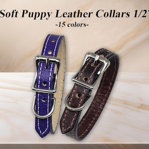 May include: Two soft puppy leather collars, each 1.27 cm wide, with silver-coloured buckles. One is a deep purple with white stitching, and the other is a rich brown. The text in the image reads "Soft Puppy Leather Collars 1/2" -15 colours-".