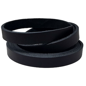 May include: A coiled black leather strip, likely for crafting or accessories. The leather appears smooth and has a consistent dark color. The strip is rolled in a spiral, showcasing its flexibility and texture. The image is well-lit, highlighting the material's quality.