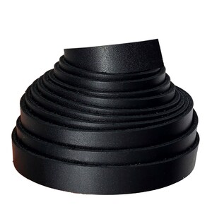 May include: A roll of black leather strips, tightly coiled. The leather appears smooth and has a slight sheen, suggesting a high-quality material. The strips are uniform in width and thickness, suitable for crafting or repair projects.