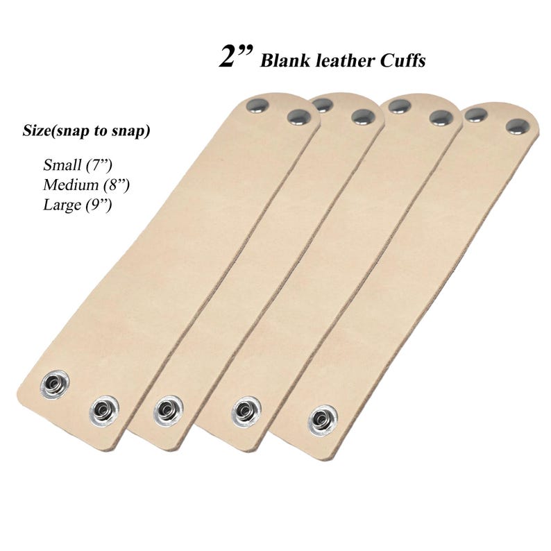 May include: Four blank leather cuffs in a light beige colour. Each cuff is 5.08 cm wide and has snaps for closure. Sizes available are small (17.78 cm), medium (20.32 cm), and large (22.86 cm).