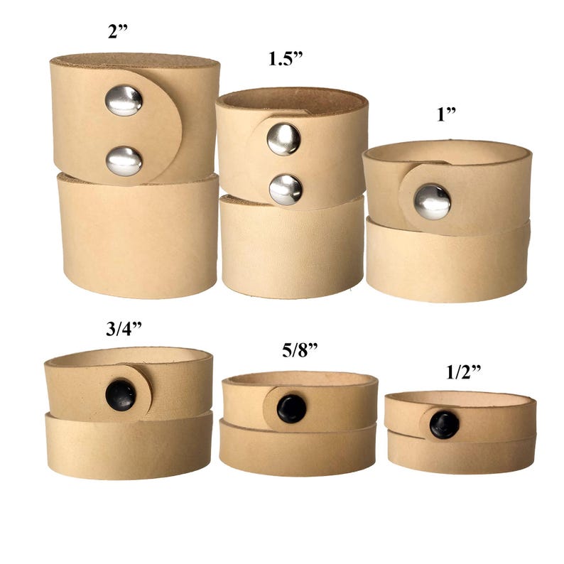 May include: A selection of light tan leather cuff bracelets in various sizes, ranging from 1.3 cm to 5.1 cm wide. Each cuff features a snap closure with either silver or black hardware. The cuffs are stacked to show the different sizes.