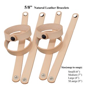 May include: Natural leather bracelets, 5/8 inch wide, with a snap closure. The bracelets are light tan in colour and feature a double-loop design with a black button. Sizes include small (15 cm), medium (18 cm), large (20 cm), and extra-large (23 cm).