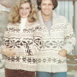 May include: A couple wearing matching cream, brown, and gray patterned knit sweaters with a zipper closure. The sweaters have a geometric design. The man is wearing blue jeans and the woman is wearing brown corduroy pants. The image has the text "PAT. 14" at the bottom.
