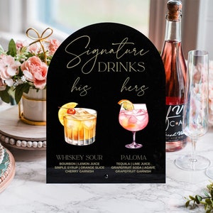 May include: Black arch-shaped sign with gold lettering that reads "Signature Drinks" with the words "his" and "hers" below.  The sign features two watercolor illustrations of cocktails with their names and ingredients listed below each.