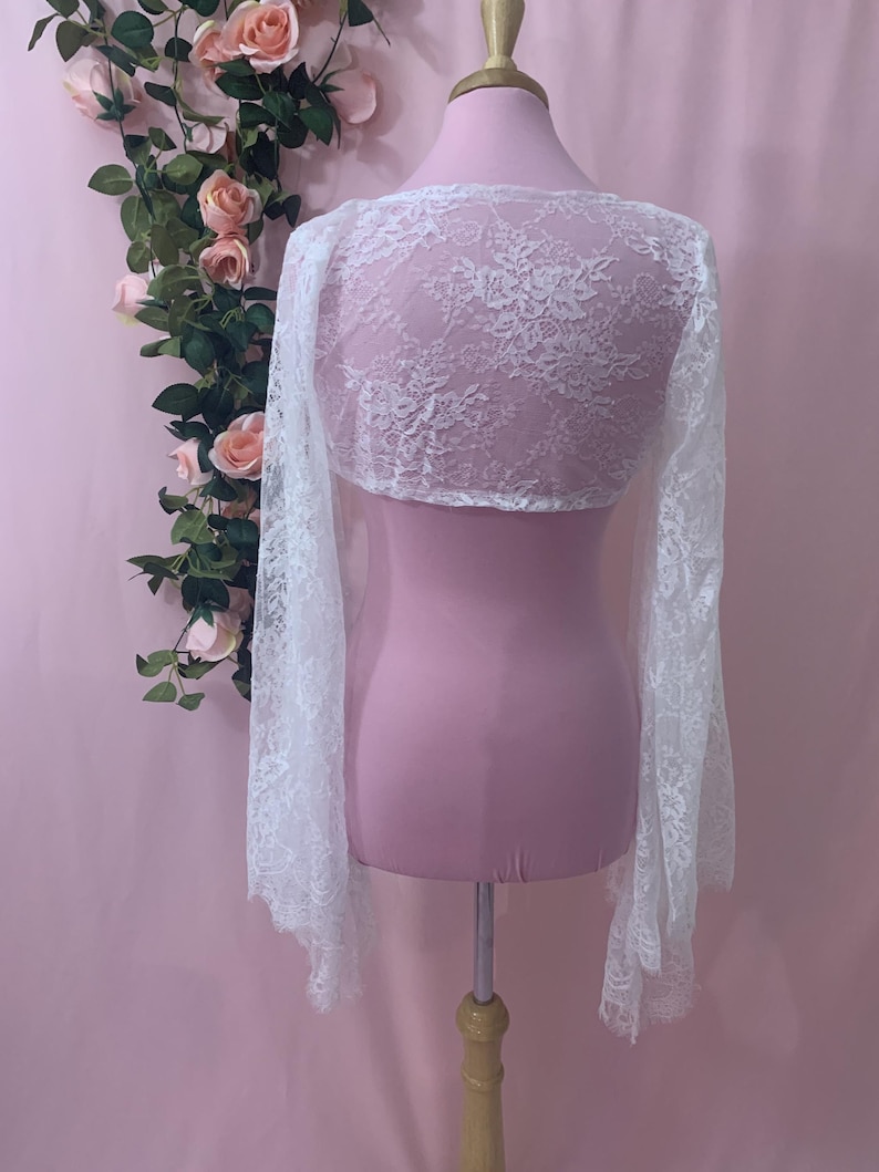 Back view of the 12.5 inch cropped white wedding bolero showing the elegant drape across the shoulders and upper back.