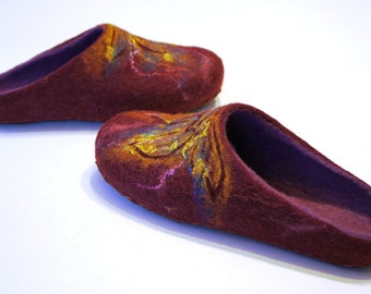 May include: Two pairs of burgundy wool slippers with a floral design in shades of yellow and pink.