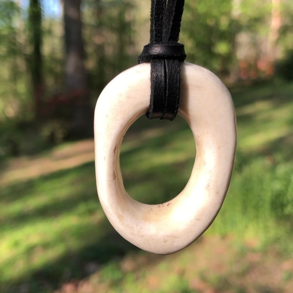 Hand carved bone pendant, with adjustable leather necklace