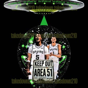 May include: A black and green graphic design featuring two basketball players wearing San Antonio Spurs jerseys. The players are standing in front of a sign that reads "Keep Out Area 51 San Antonio Spurs". The graphic is surrounded by a green and black galaxy design.