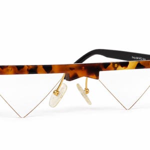 Occhiali da vista unisex senza montatura, modello triangolare, unici e vintage, di design tedesco.