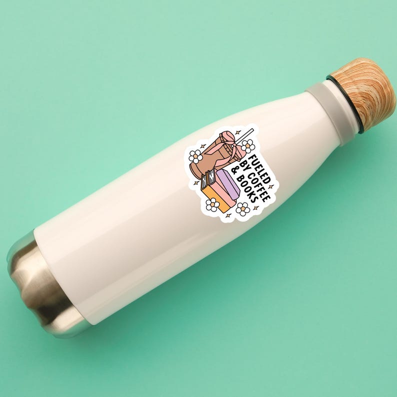 May include: White stainless steel water bottle with a sticker that says "Fueled by Coffee & Books". The sticker features a cartoon illustration of a coffee cup, a stack of books, and flowers.
