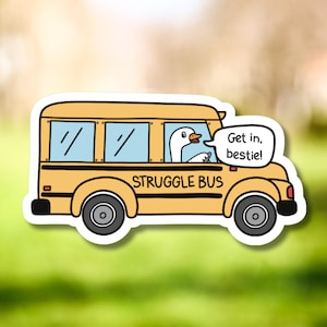 May include: A yellow school bus with a goose driving. The bus has the words "STRUGGLE BUS" on the side. The goose is wearing a white shirt and has a speech bubble that says "Get in, bestie!"