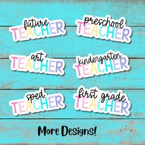 May include: Six colorful stickers with the text "Teacher" in different colors and fonts. The stickers say "Future Teacher", "Preschool Teacher", "Art Teacher", "Kindergarten Teacher", "Sped Teacher", and "First Grade Teacher". The stickers are on a blue wooden background. The text "More Designs!" is at the bottom of the image.