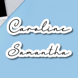 May include: Two white stickers with black cursive writing. The top sticker says "Caroline" and the bottom sticker says "Samantha".